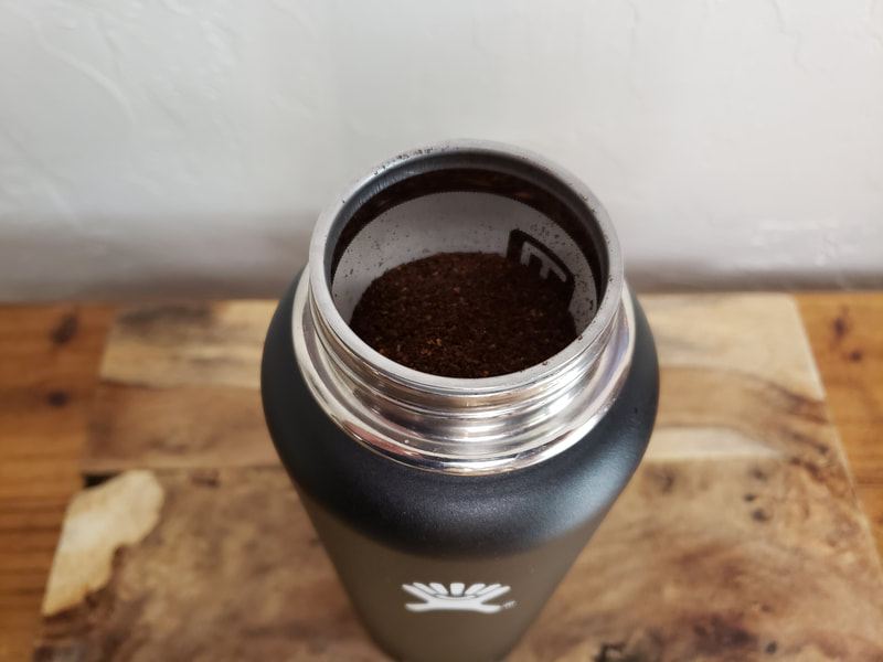 FlavorFuze Steel Infuser for Wide Mouth Bottles like Hydro Flasks.  Shown with coffee in the infuser.