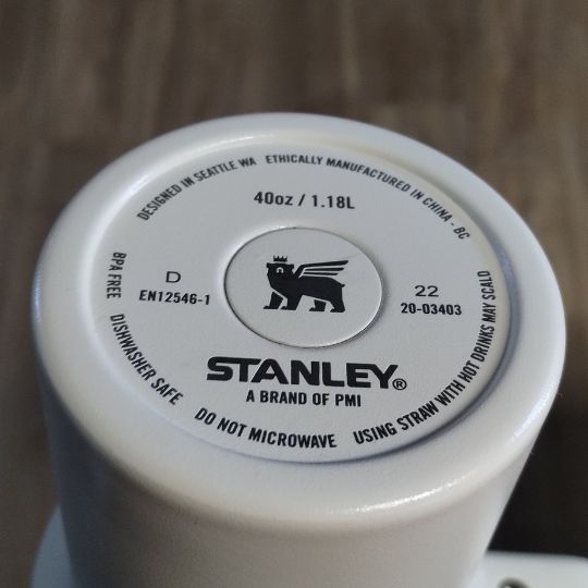 The lead seal is located below the cover in the center with the Stanley logo